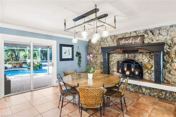 a dining room with furniture and a fireplace