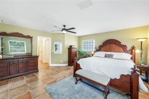 a living room with furniture a rug and a window