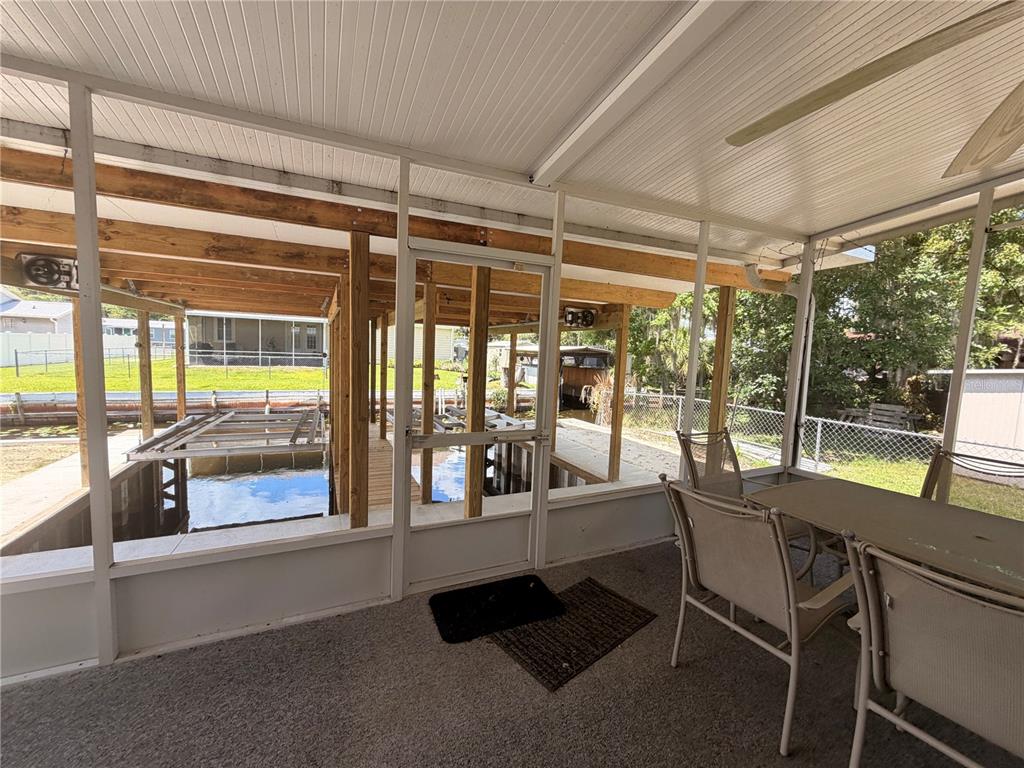 24521 Alligator Road Astor, FL 32102 - Photo 32 of 51 a very nice looking room with a large window and pool table
