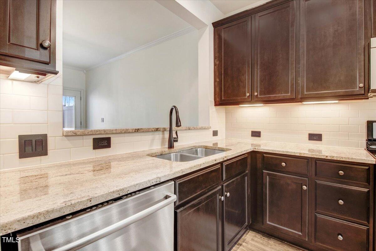 736 Wickham Ridge Road Apex, NC 27539 - Photo 10 of 41 a kitchen with a sink and cabinets