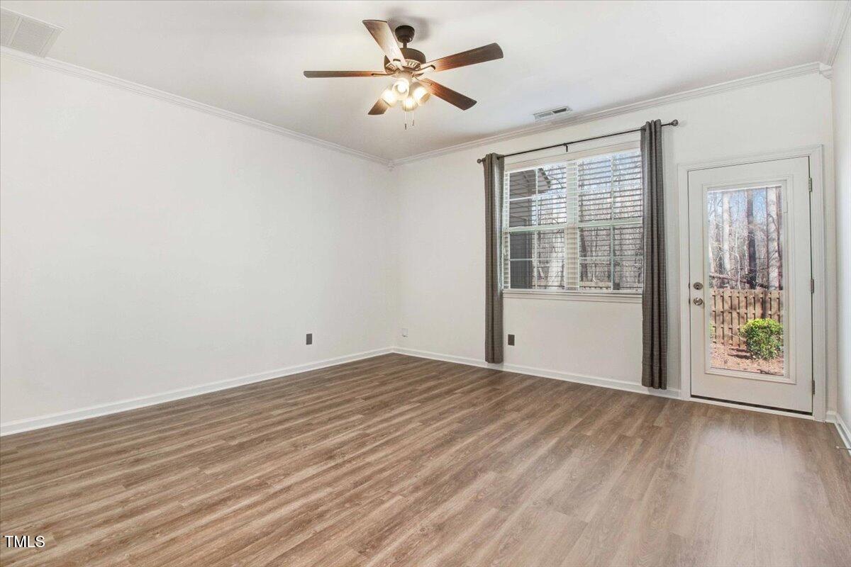 736 Wickham Ridge Road Apex, NC 27539 - Photo 18 of 41 wooden floor in an empty room with a window
