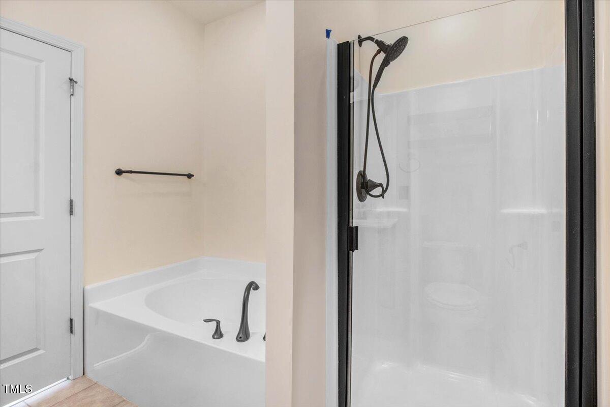 736 Wickham Ridge Road Apex, NC 27539 - Photo 24 of 41 a bathroom with a shower and a shower