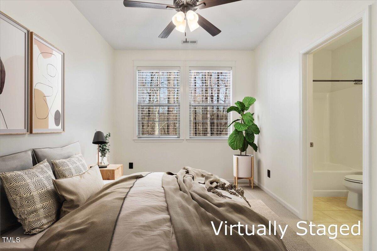 736 Wickham Ridge Road Apex, NC 27539 - Photo 26 of 41 a living room with furniture and a large window