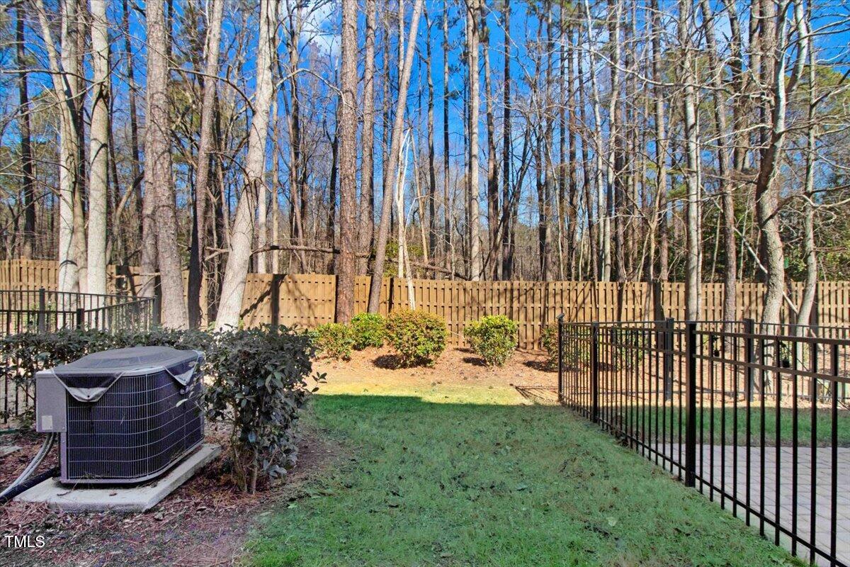 736 Wickham Ridge Road Apex, NC 27539 - Photo 36 of 41 a view of a backyard with sitting area