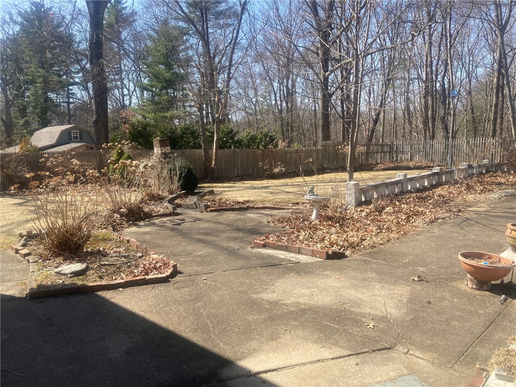 25 Oakridge Road Scituate, RI 02857 - Photo 12 of 16 patio and all fenced in mature backyard