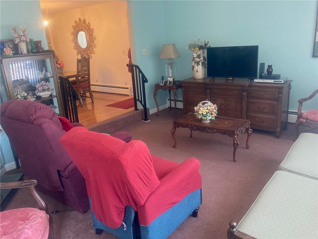 25 Oakridge Road Scituate, RI 02857 - Photo 16 of 16 fireplace in living room with plenty of natural light