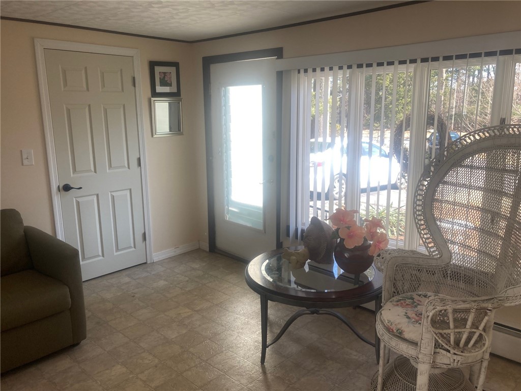 25 Oakridge Road Scituate, RI 02857 - Photo 2 of 16 breezeway has front and rear entrance and is heated
