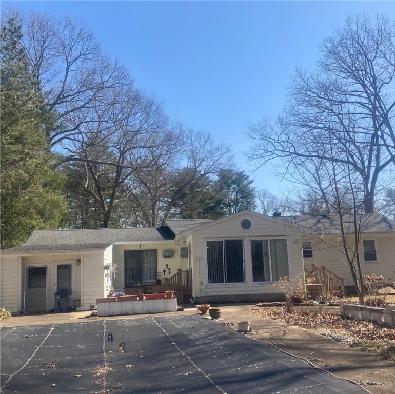 25 Oakridge Road Scituate, RI 02857 - Photo 3 of 16 view over in-ground pool of rear of house