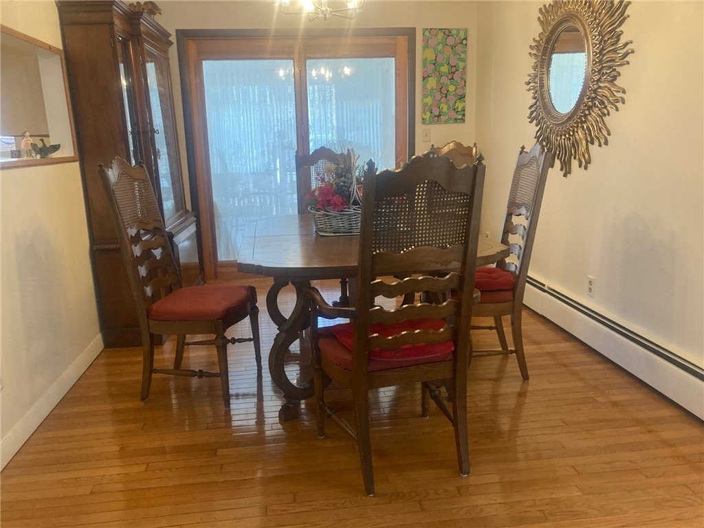 25 Oakridge Road Scituate, RI 02857 - Photo 5 of 16 hardwood floors in formal dining room and also access to outside via sliders