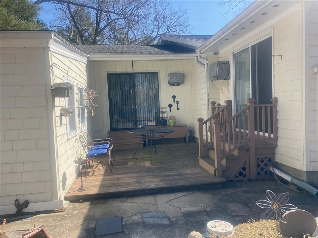25 Oakridge Road Scituate, RI 02857 - Photo 6 of 16 courtyard between breezeway and florida room with deck, great retreat