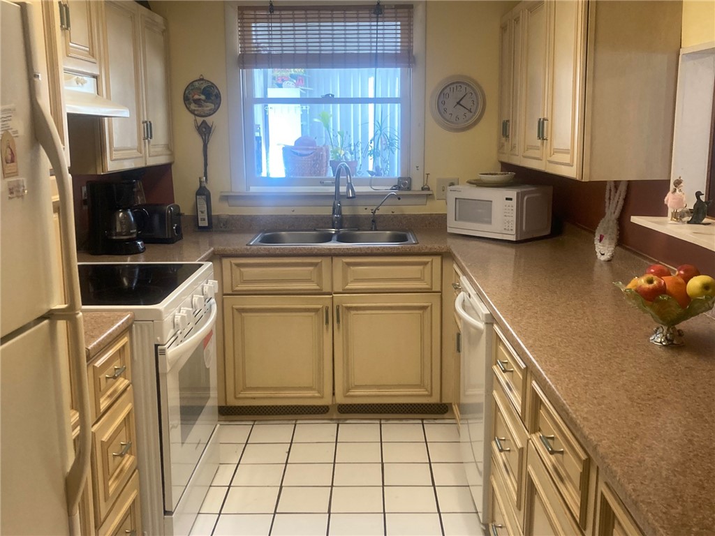 25 Oakridge Road Scituate, RI 02857 - Photo 7 of 16 galley style kitchen with a serving passthrough to dining room
