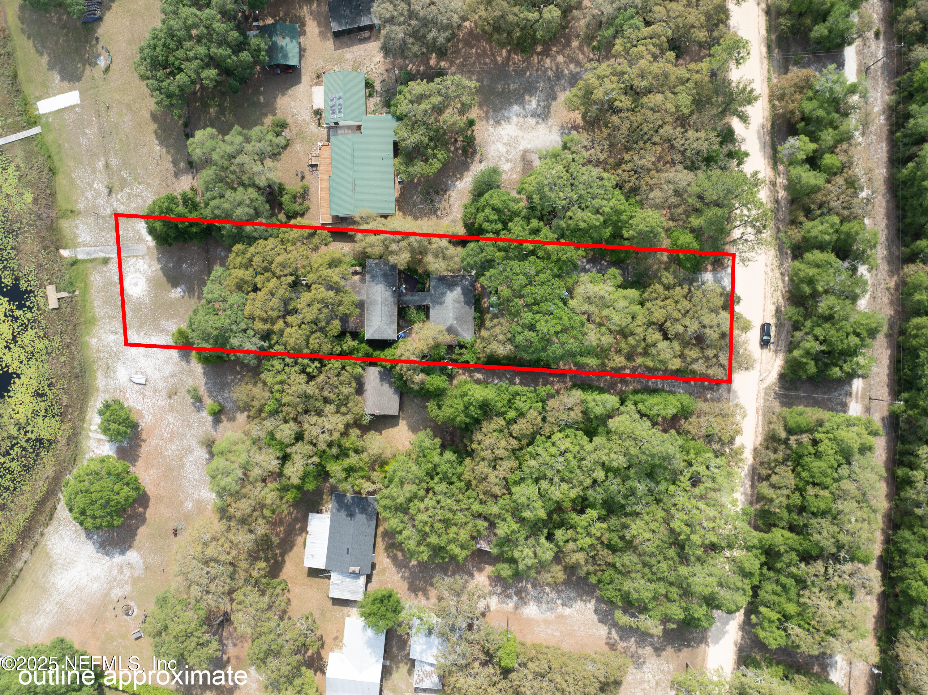 5915 White Sands Road Keystone Heights, FL 32656 - Photo 47 of 47 an aerial view of a house with a yard and garden