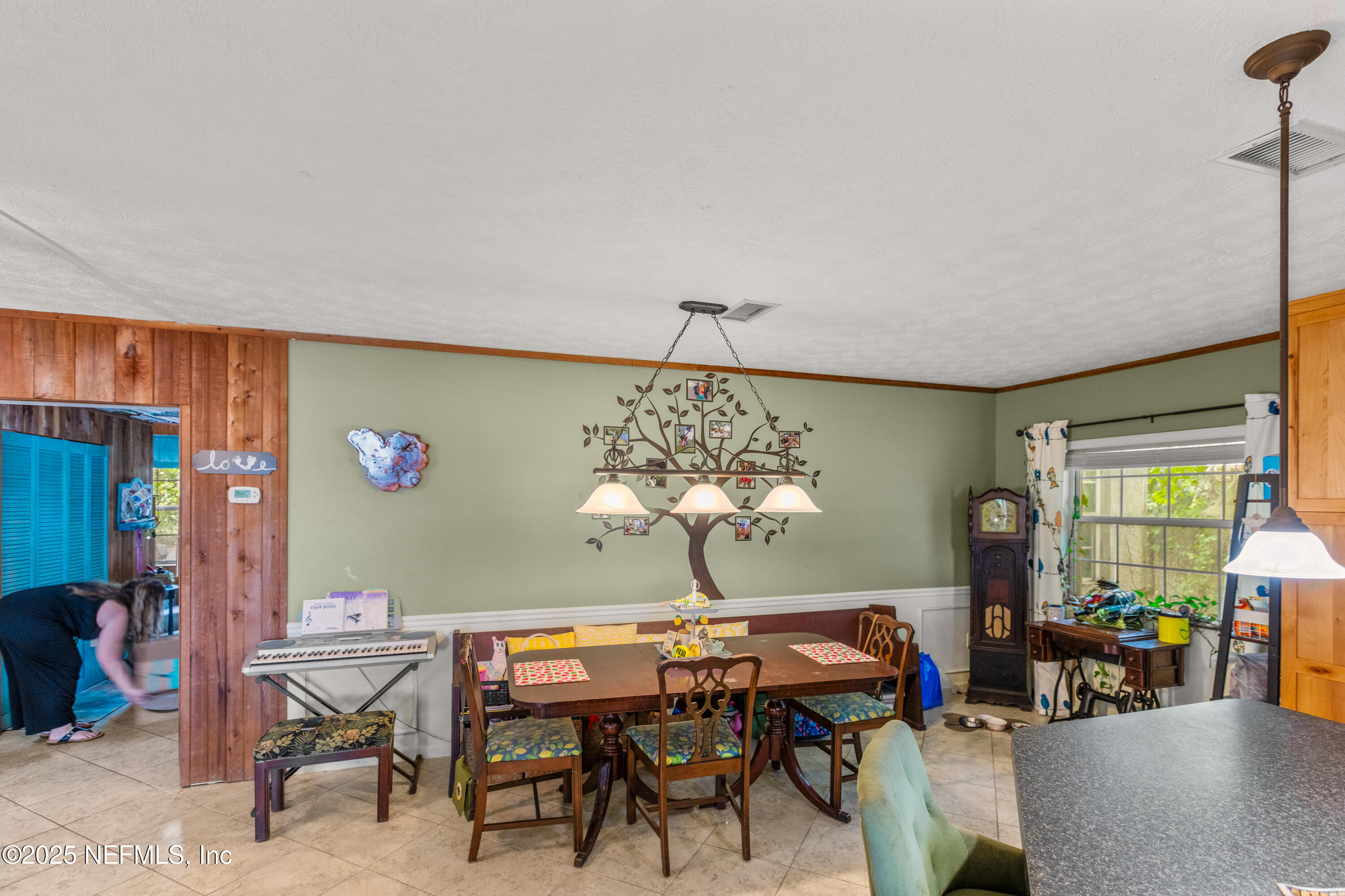 5915 White Sands Road Keystone Heights, FL 32656 - Photo 9 of 47 a view of a dining room with furniture window and outside view