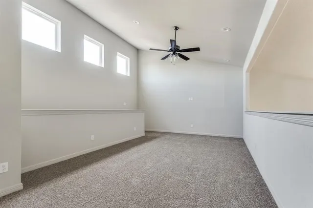 a bathroom with a granite countertop sink and a bathtub