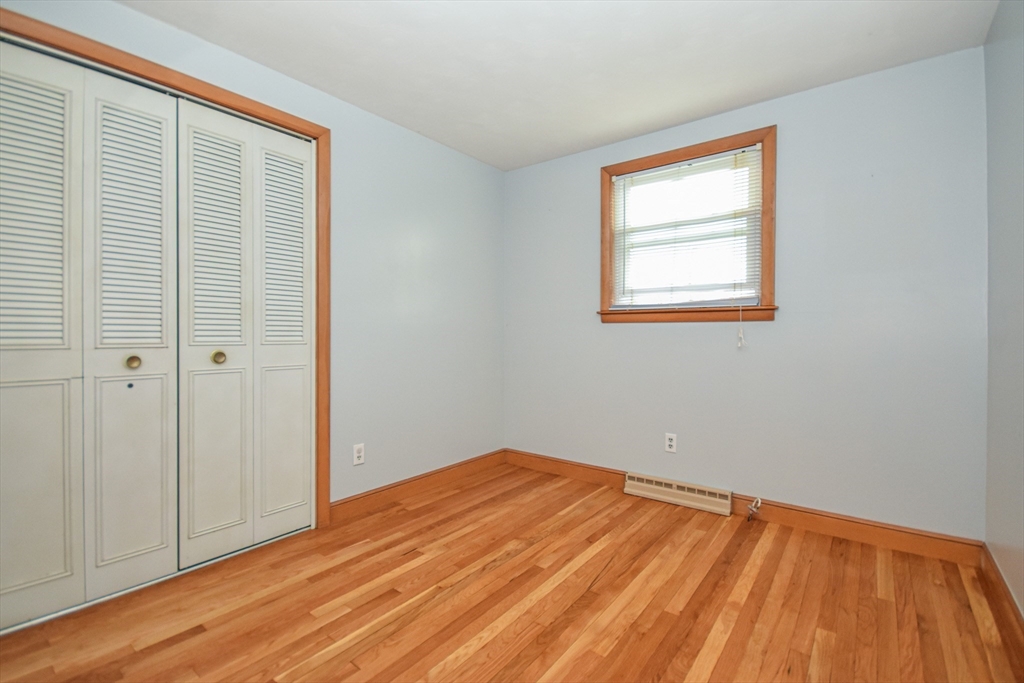 5 Brewster Road Randolph, MA 02368 - Photo 15 of 21 a view of empty room with wooden floor and fan