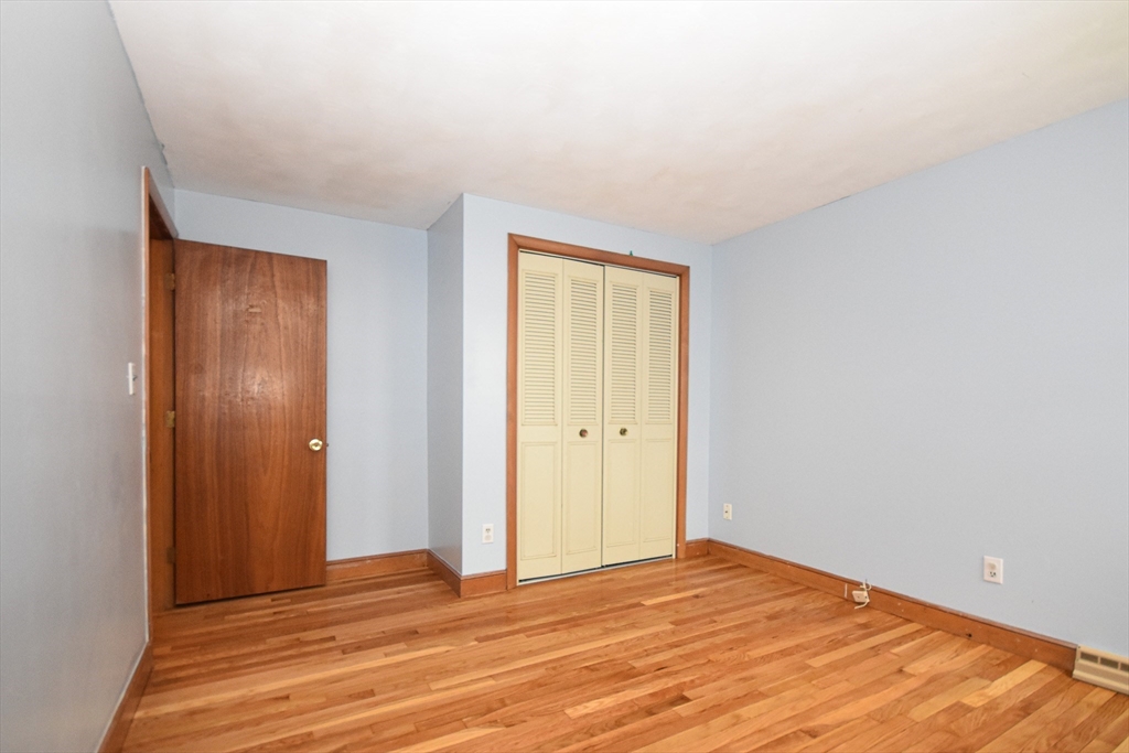5 Brewster Road Randolph, MA 02368 - Photo 16 of 21 a view of empty room with wooden floor