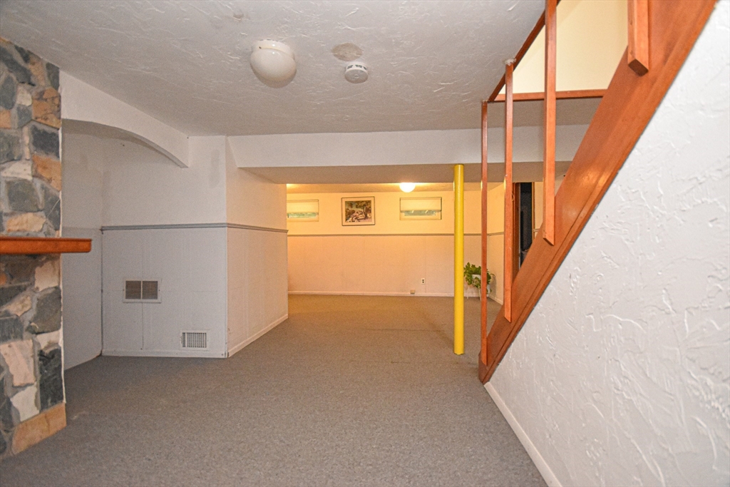 5 Brewster Road Randolph, MA 02368 - Photo 18 of 21 a view of a hallway with stairs