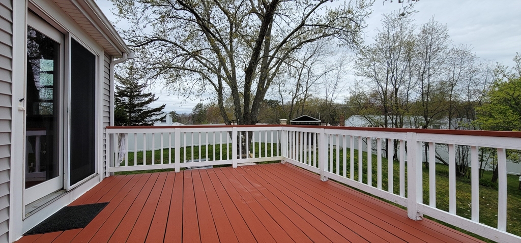 5 Brewster Road Randolph, MA 02368 - Photo 3 of 21 a view of balcony with wooden floor and fence