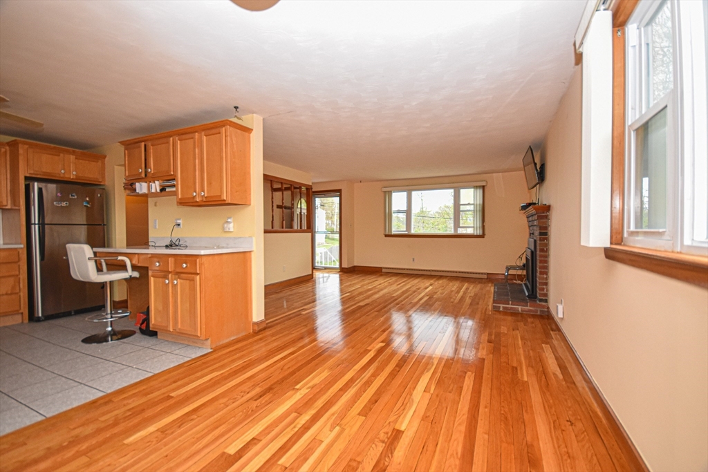 5 Brewster Road Randolph, MA 02368 - Photo 9 of 21 a view of a kitchen with a sink and dishwasher with wooden floor