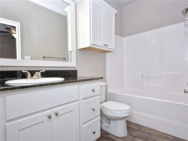 a bathroom with a sink a toilet and a bathtub