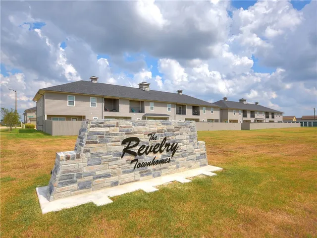a view of a swimming pool with outdoor seating