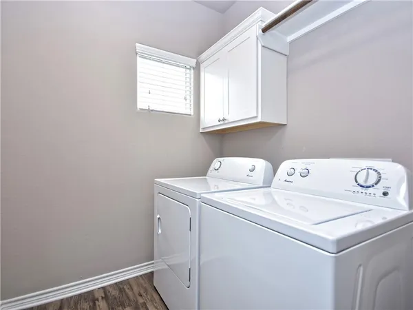 a utility room with dryer and washer