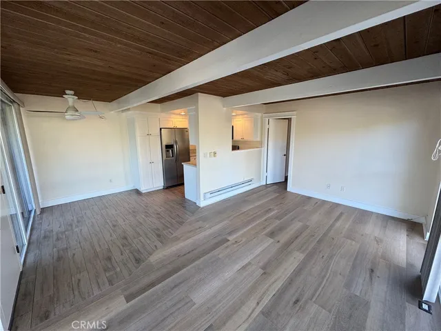 a view of a livingroom with wooden floor