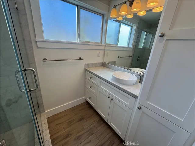 a bathroom with a sink a toilet and vanity