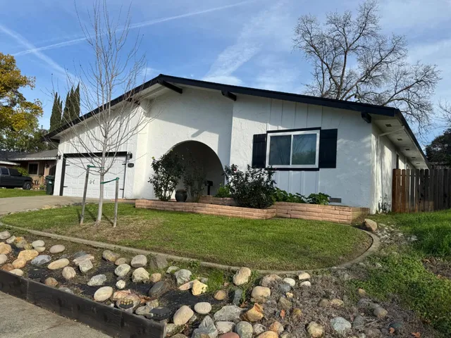 a house view with a garden space