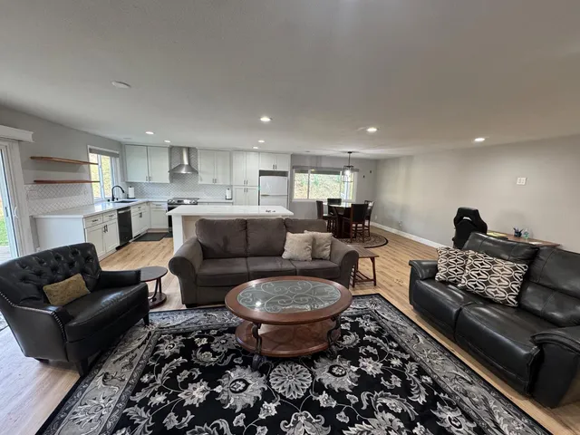 a living room with furniture and a rug