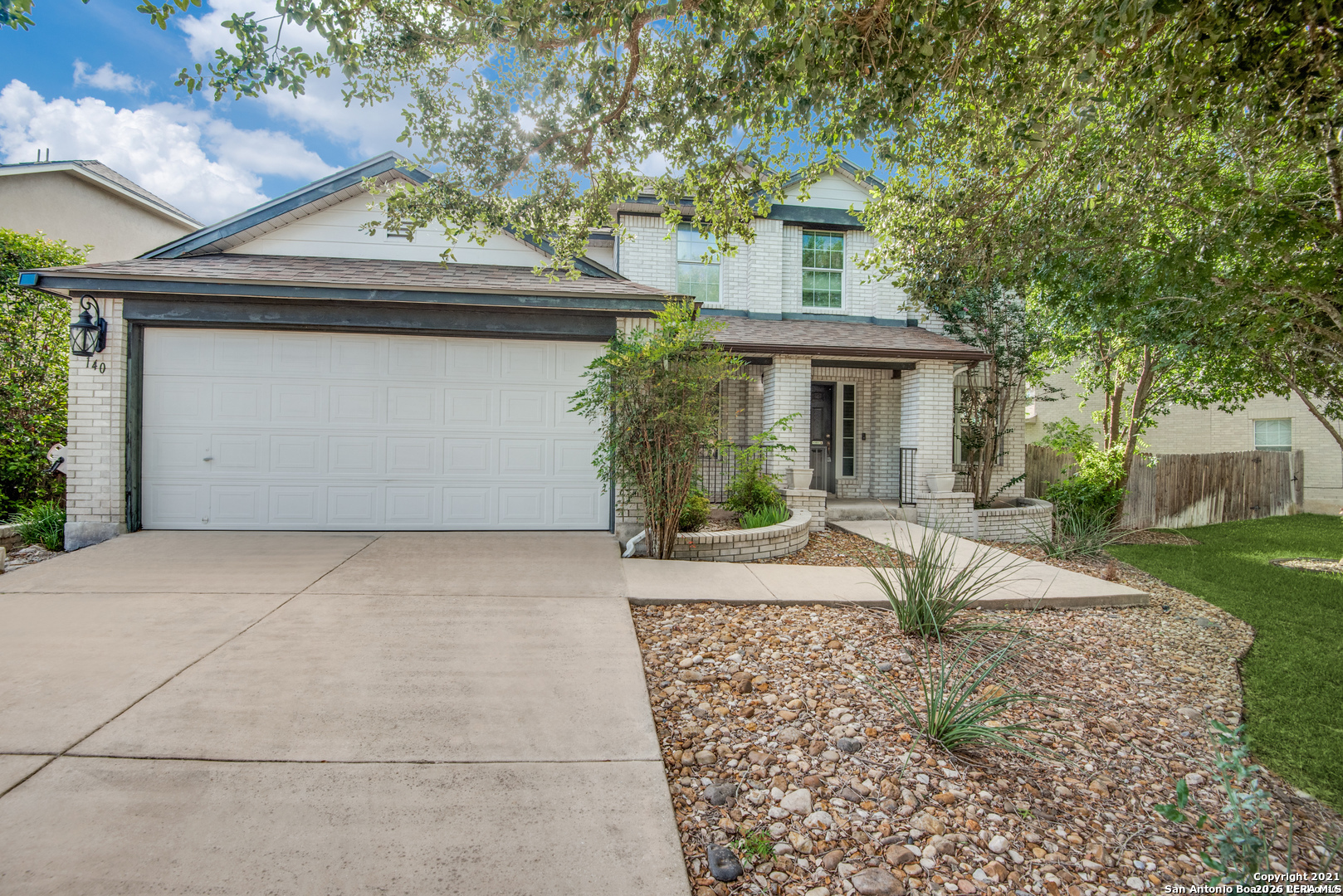 140 Springtree Parkway Cibolo, TX 78108 - Photo 1 of 25 a front view of a house with garden