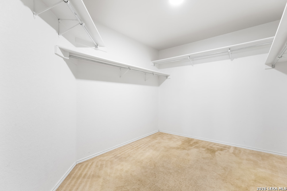 140 Springtree Parkway Cibolo, TX 78108 - Photo 16 of 25 a view of a room with racks on the wall