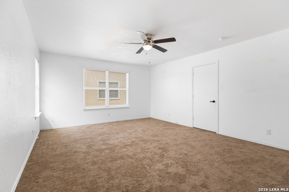 140 Springtree Parkway Cibolo, TX 78108 - Photo 19 of 25 a view of an empty room with a window
