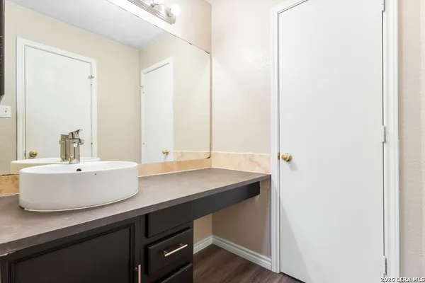 a bathroom with a sink and a mirror