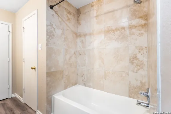 a bathroom with a white bath tub