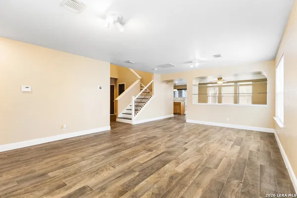 a view of an entryway with wooden floor