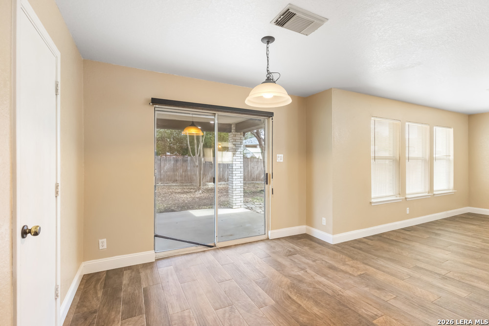 140 Springtree Parkway Cibolo, TX 78108 - Photo 10 of 25 a view of livingroom with hardwood floor and window