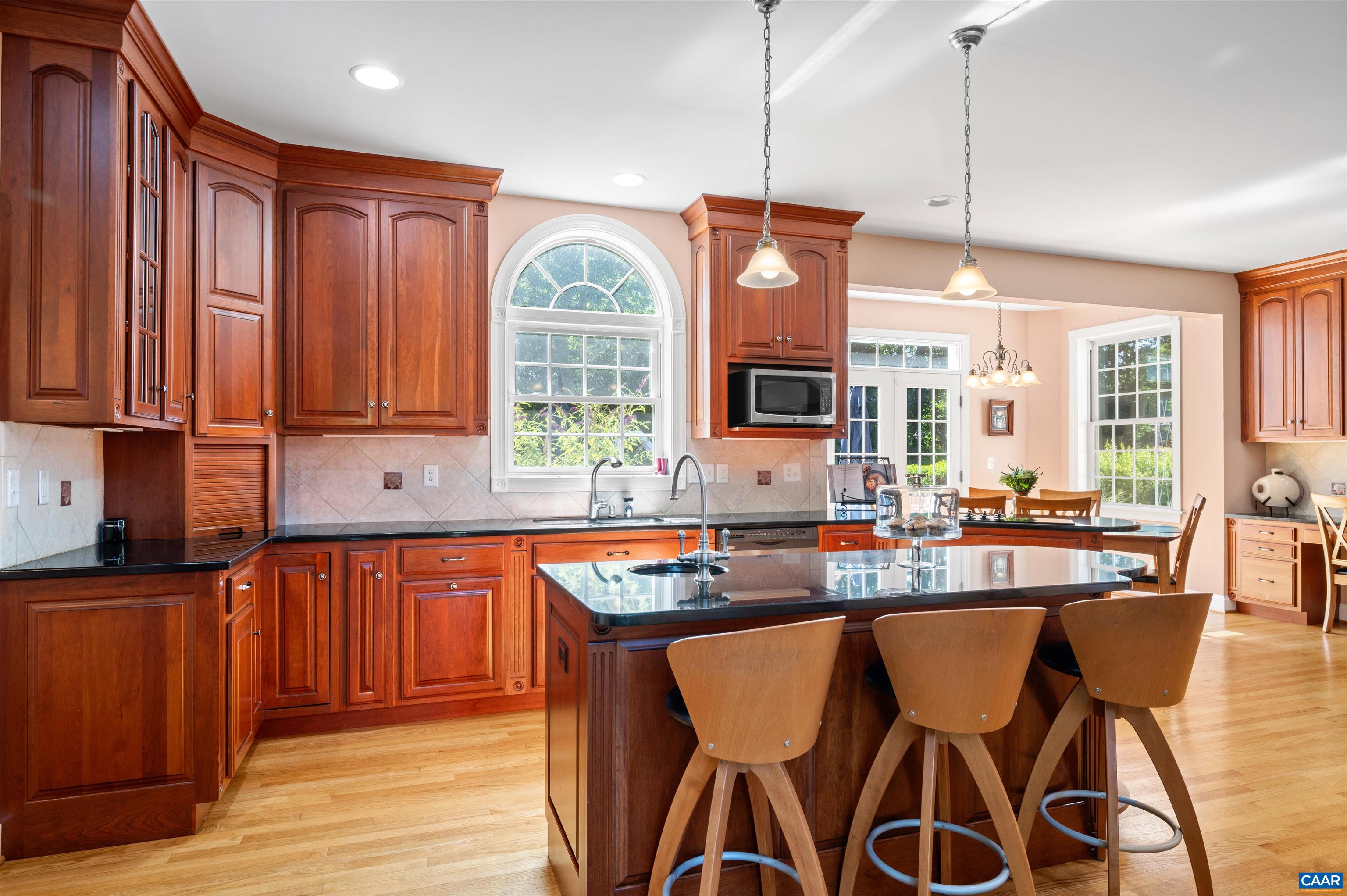 2865 Proffit Road Charlottesville, VA 22911 - Photo 13 of 75 a kitchen with stainless steel appliances granite countertop a stove a sink dishwasher and a wooden cabinets