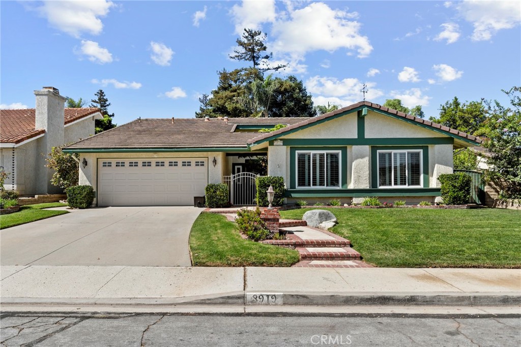 3919 Southhampton Road Moorpark, CA 93021 - Photo 1 of 1 a front view of a house with a yard
