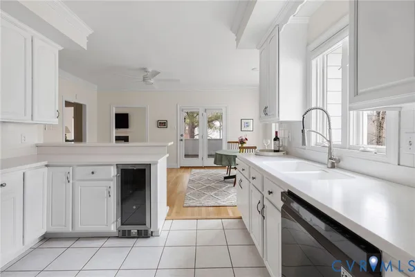 a large kitchen with a stove sink and cabinets