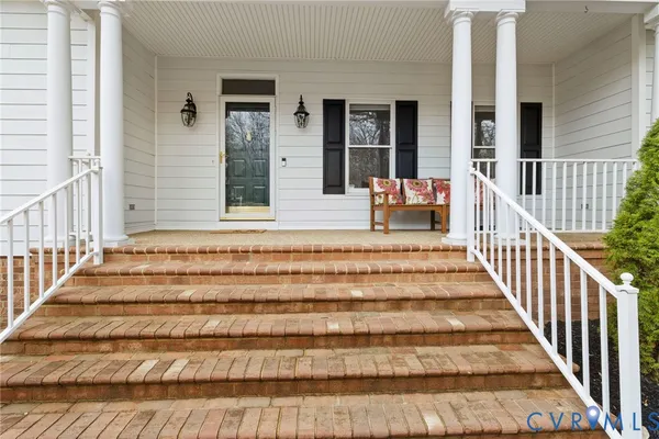 a view of entryway with wooden floor and a rug