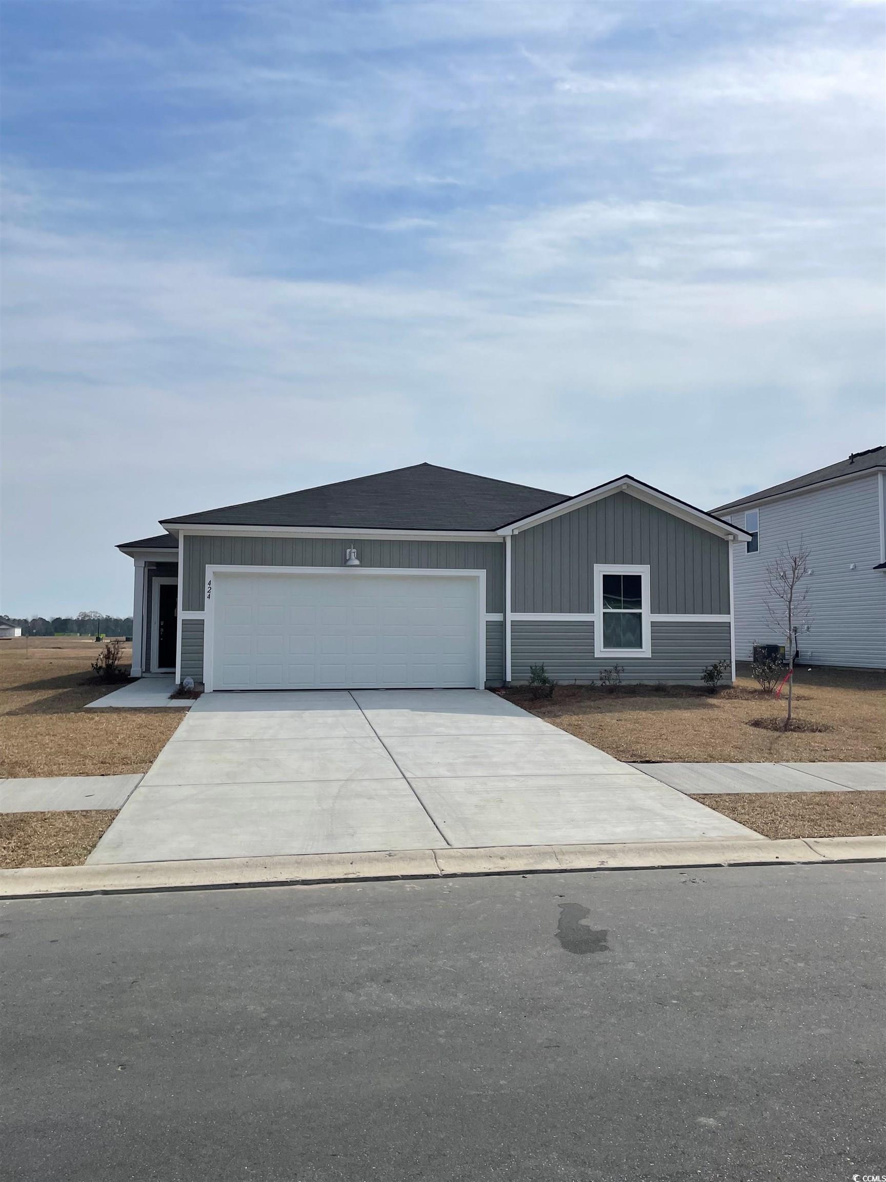 424 Ribbon Rail Way Loris, SC 29569 - Photo 1 of 32 View of front facade featuring an attached garage,