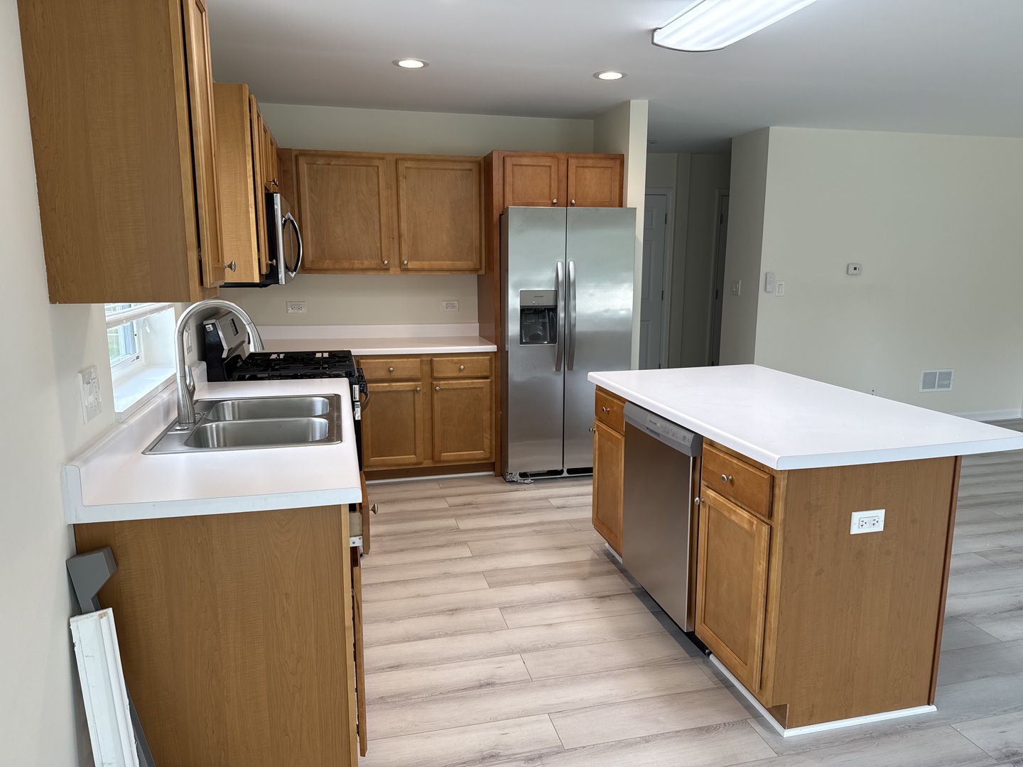 922 West Bergera Road Braidwood, IL 60408 - Photo 4 of 19 a kitchen with stainless steel appliances a sink and a refrigerator