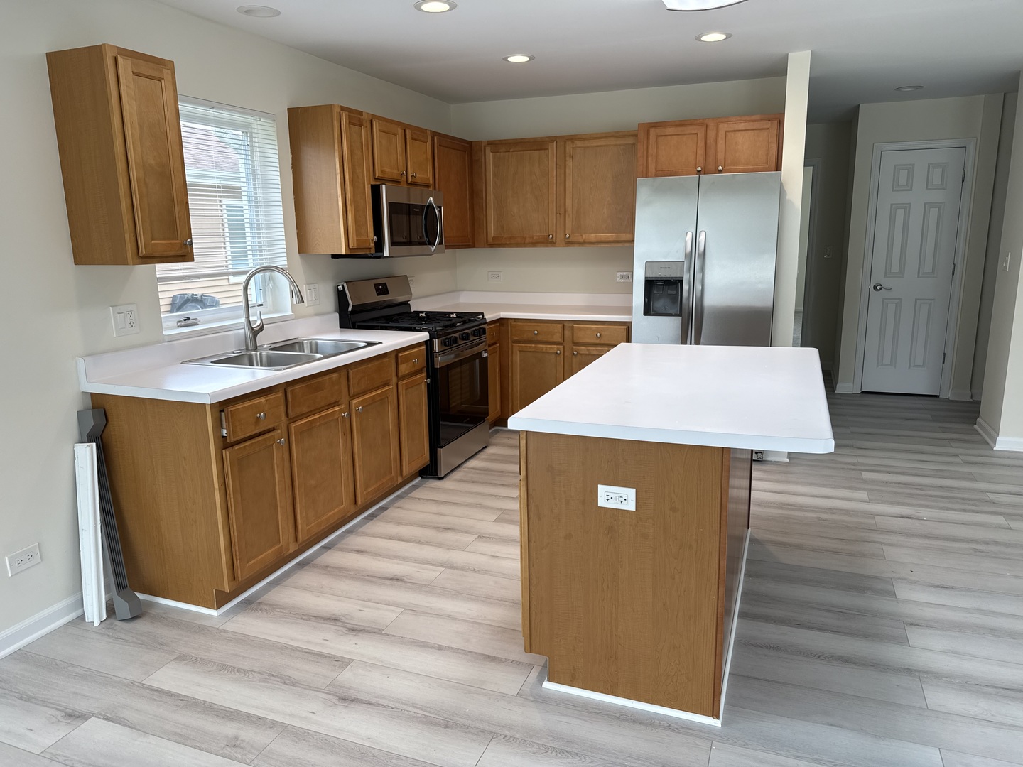 922 West Bergera Road Braidwood, IL 60408 - Photo 5 of 19 a kitchen with stainless steel appliances granite countertop wooden cabinets a refrigerator and a sink