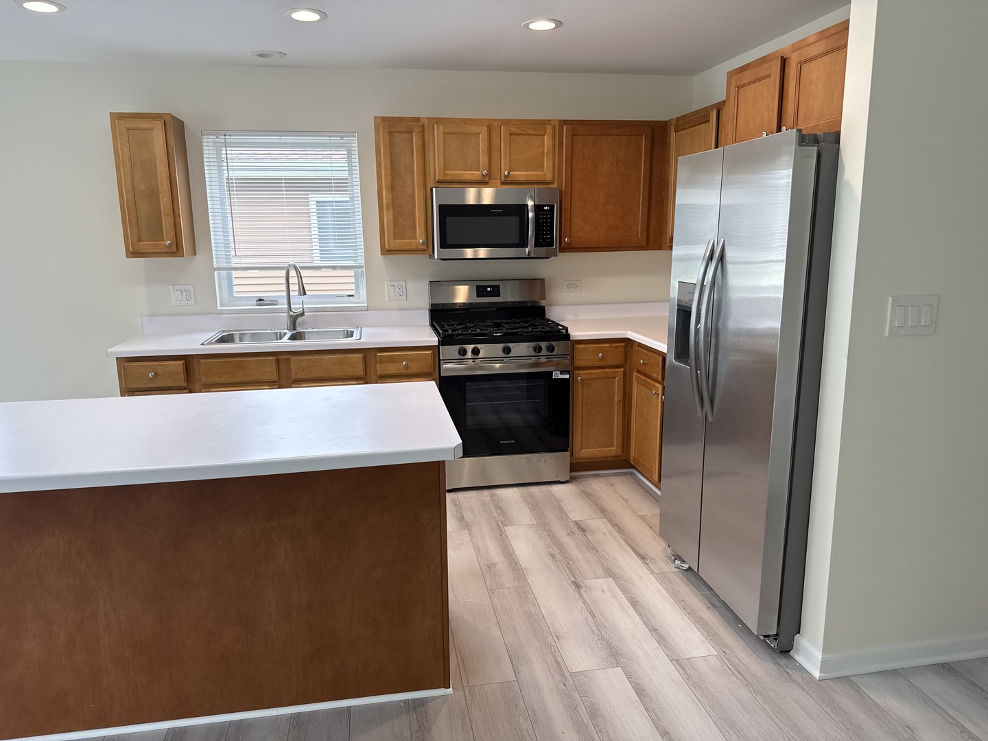 922 West Bergera Road Braidwood, IL 60408 - Photo 6 of 19 a kitchen with stainless steel appliances granite countertop a refrigerator a stove top oven a sink and dishwasher