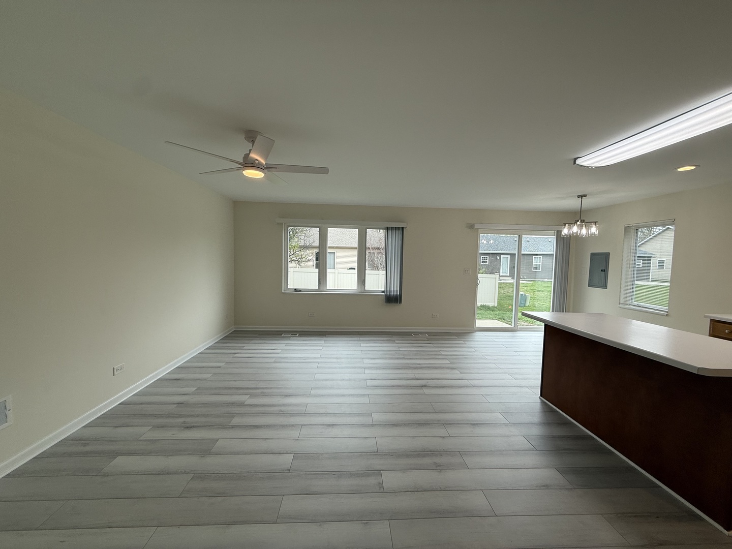 922 West Bergera Road Braidwood, IL 60408 - Photo 8 of 19 a view of an empty room with a window and wooden floor