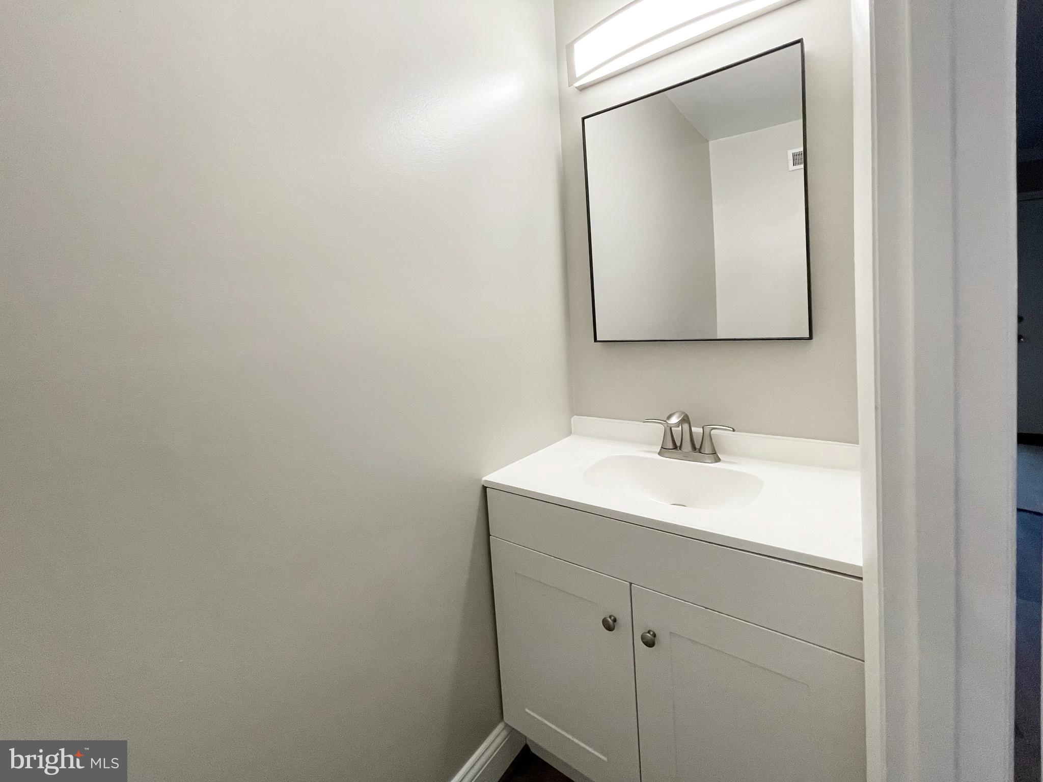 11968 Greywing Court Reston, VA 20191 - Photo 11 of 13 a bathroom with a sink and a mirror