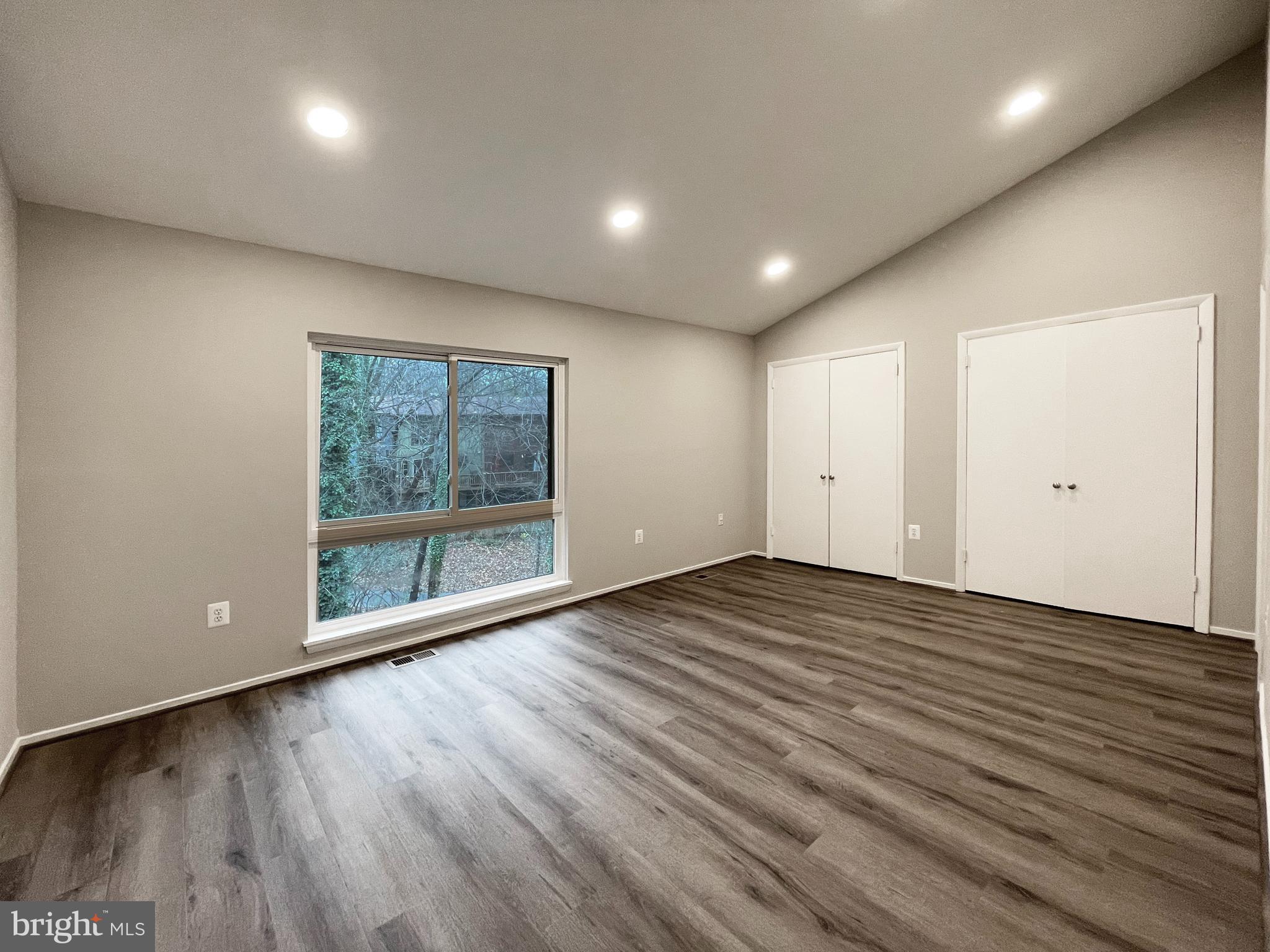 11968 Greywing Court Reston, VA 20191 - Photo 12 of 13 a view of empty room with wooden floor and fan