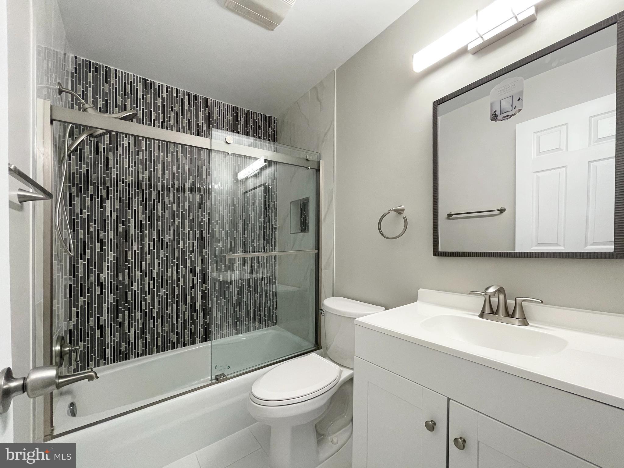 11968 Greywing Court Reston, VA 20191 - Photo 6 of 13 a bathroom with a sink toilet and shower