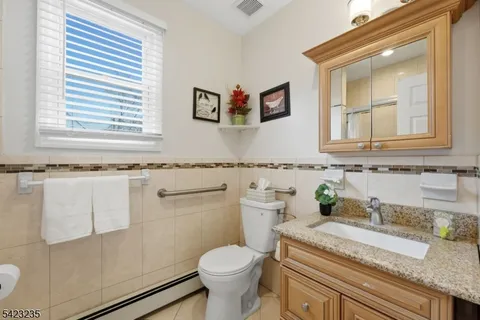 a bedroom with a bed and cabinet